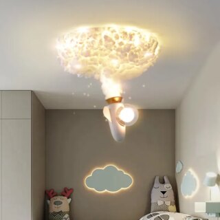 Lustre nuage avec une fusée qui descend. L'ampoule est dans le cockpit